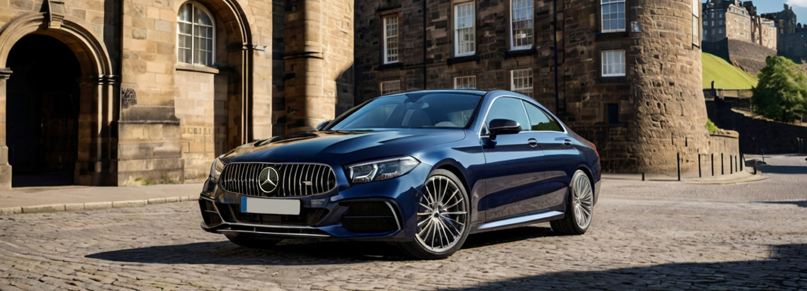 A luxury Mercedes S-Class parked in front of Edinburgh castle